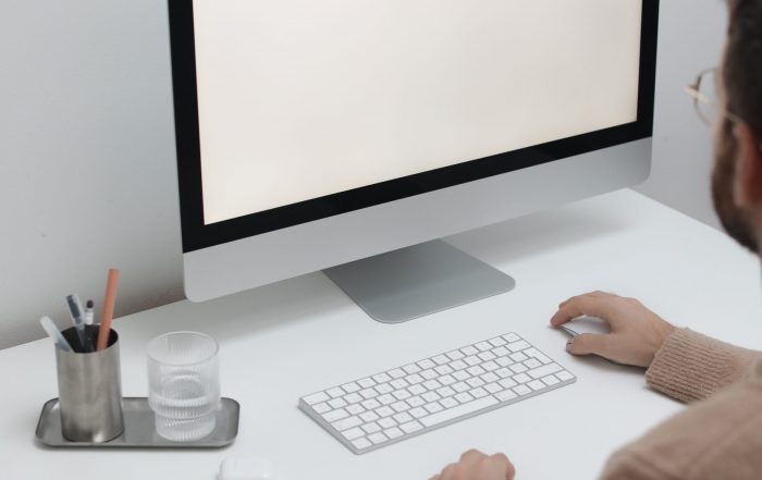 Free Crop man working on computer in workplace Stock Photo