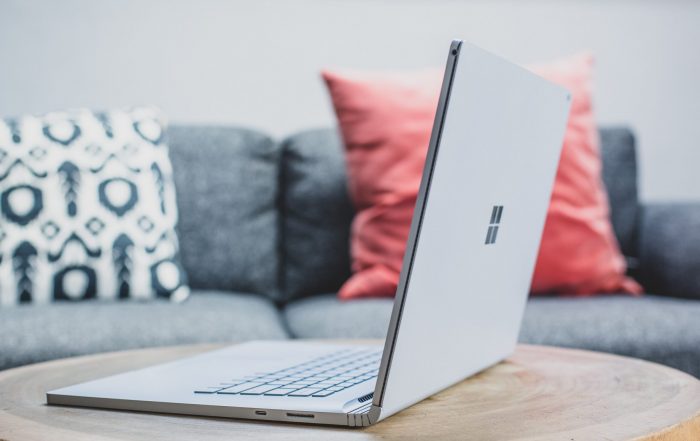 macbook pro on white couch