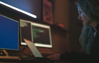 Free Side View of a Woman Using a Laptop Stock Photo